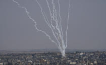 Rockets are launched from the Gaza Strip towards Israel, in Gaza City, Saturday, Aug. 6, 2022. (AP Photo/Hatem Moussa)