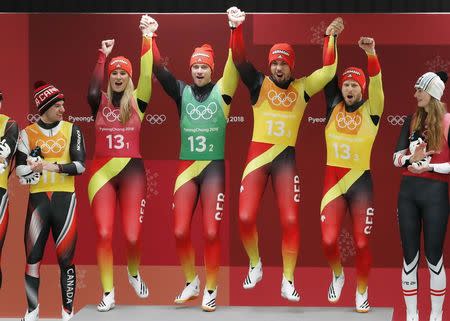 Luge - Pyeongchang 2018 Winter Olympic Games - Team Relay - Pyeongchang, South Korea - February 15, 2018 - Gold medalists Natalie Geisenberger, Johannes Ludwig, Tobias Wendl and Tobias Arlt of Germany celebrate during the victory ceremony. REUTERS/Arnd Wiegmann