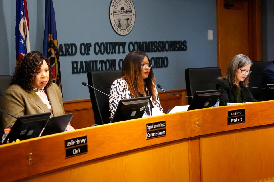 Hamilton County Commissioners, (L-R), Stephanie Summerow Dumas, Alicia Reece and Denise Driehaus, were all overcome with emotion as they talked about the resignation of Auditor Brigid Kelly, due to severe illness, Thursday, March 21, 2024. It was announced Kelly has entered hospice care. Chief Deputy Auditor Amy Humphrey was sworn in as interim.