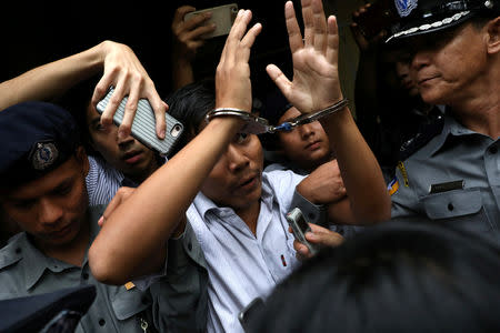 Reuters journalist Kyaw Soe Oo departs Insein court after his verdict announcement in Yangon, Myanmar, September 3, 2018. REUTERS/Ann Wang