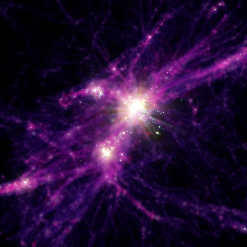 An artist's conception of star bursting galaxies early in the history of the universe is shown