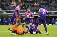 Netherlands' Memphis Depay, down left, is challenged by Germany's players during the international friendly soccer match between Germany and Netherlands at the Deutsche Bank Park in Frankfurt, Germany on Tuesday, March 26, 2024. (AP Photo/Martin Meissner)