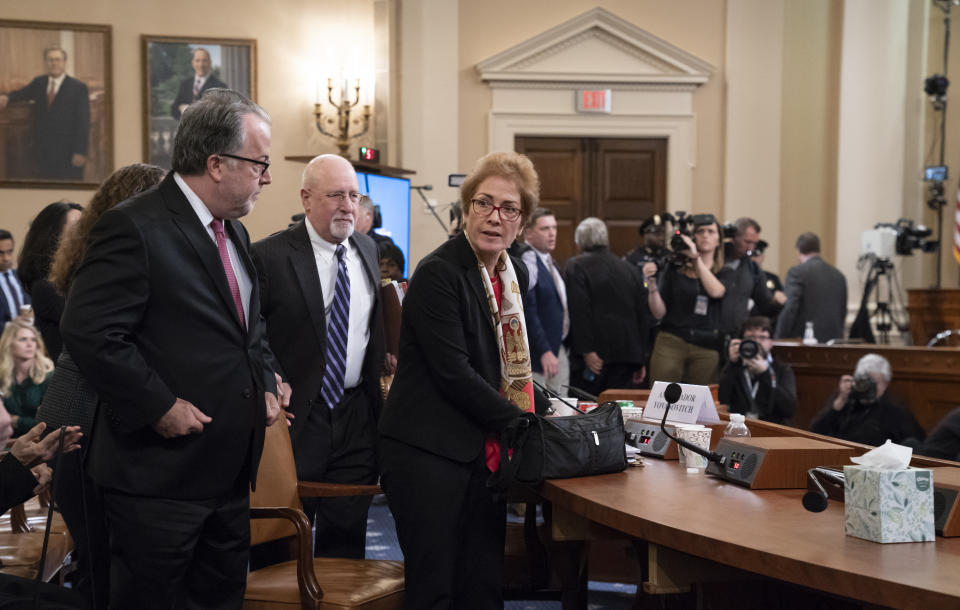 Former U.S. Ambassador to Ukraine Marie Yovanovitch looks up as the audience applauds at the end her testimony before the House Intelligence Committee, Friday, Nov. 15, 2019, on Capitol Hill in Washington, in the second public impeachment hearing on President Donald Trump's efforts to tie U.S. aid for Ukraine to investigations of his political opponents. (AP Photo/J. Scott Applewhite)