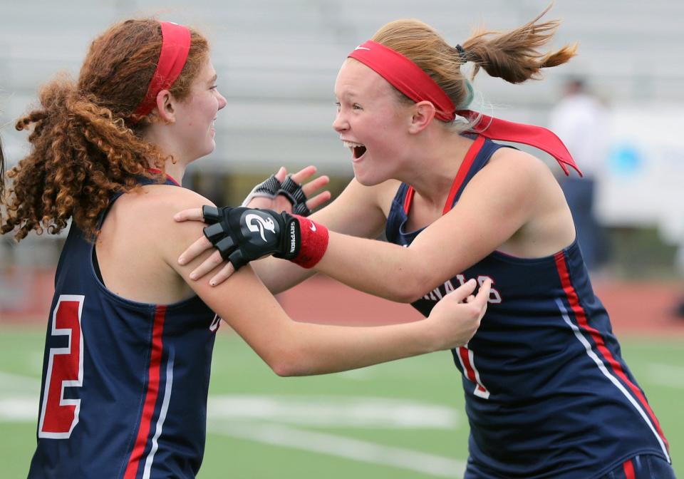 10. Thomas Worthington field hockey players Rowan Casey (right) and Sophia Borghese celebrate while waiting to receive their state championship medals Nov. 5 after a 3-2 overtime win over Watterson.