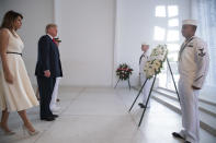 <p>President Donald Trump and first lady Melania Trump, accompanied by Command Commander Adm. Harry Harris, left rear, participate in a wreath laying ceremony at the USS Arizona Memorial, part of the World War II Valor in the Pacific National Monument, in Joint Base Pearl Harbor-Hickam, Hawaii, adjacent to Honolulu, Hawaii, Friday, Nov. 3, 2017. (Photo: Andrew Harnik/AP) </p>