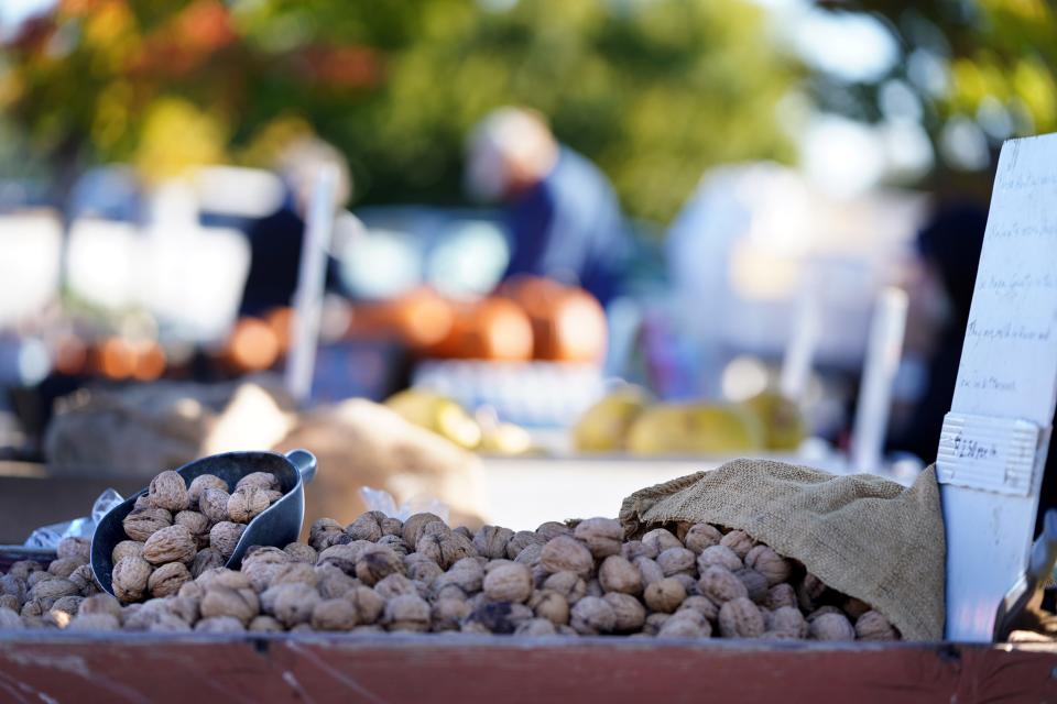 Fresh nuts, for cracking and eating by themselves or for adding to a Thanksgiving desert, are for sale at the Redding Farmers Market on Oct. 29, 2023. The market is seeing steady growth in farmers bringing in their foods and the types of items being offered.