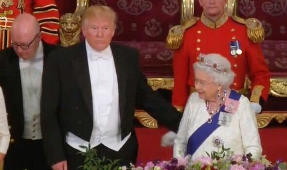 President Donald Trump touching the Queen at State Dinner