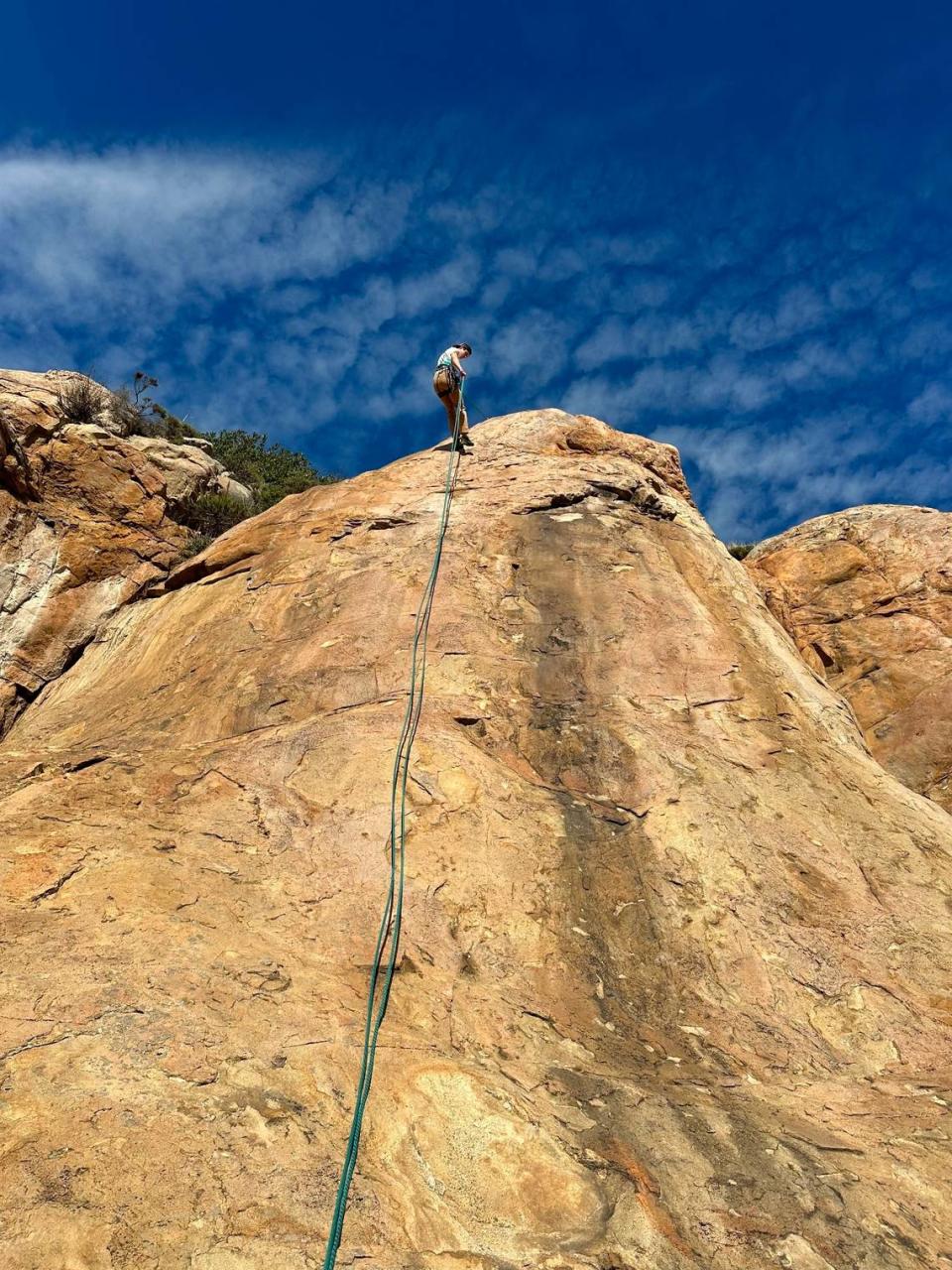 Kenneth Taylor rappels down a rock face. Taylor, a third-year Cal Poly student, died while on a climbing trip at Salmon Creek waterfall in Big Sur on April 6, 2024. Courtesy of Hadas Tankel