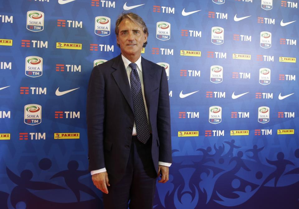 Coach of the Italian national soccer team Roberto Mancini poses prior to the presentation of the 2018/19 Serie A calendar in Milan, Italy, Thursday, July 26, 2018. (AP Photo /Luca Bruno)