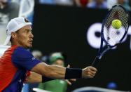 Australia's Lleyton Hewitt hits a shot during his second round match against Spain's David Ferrer at the Australian Open tennis tournament at Melbourne Park, Australia, January 21, 2016. REUTERS/Thomas Peter