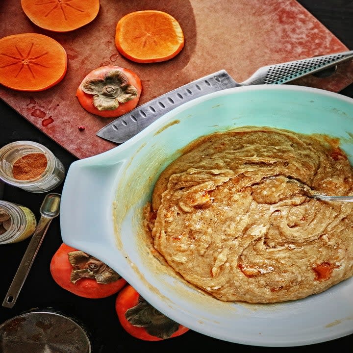 Persimmon bread batter in a mixing bowl.