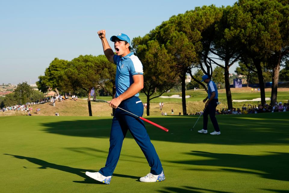 Europe's Viktor Hovland reacts after a putt by teammate Ludvig Aberg on the sixth green during day one for the 44th Ryder Cup golf.