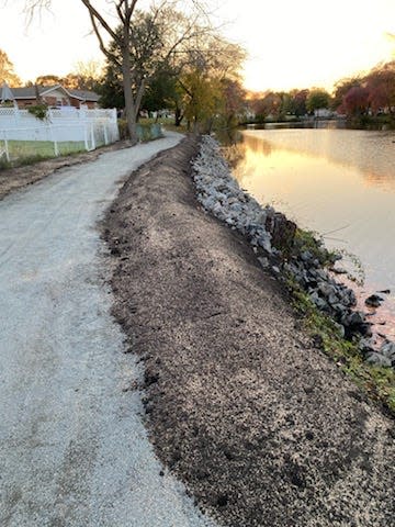 Caryn Murphy credits the improvements of the walking path along Lake Alberta in Neptune to Committeeman Keith Cafferty.