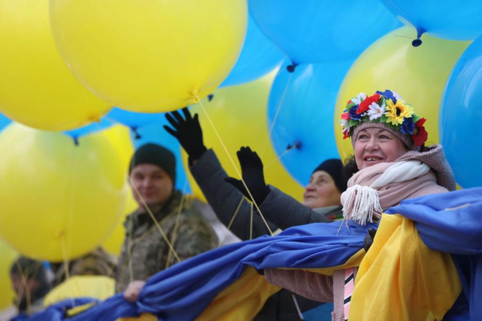 <span class="caption">Activists in the Donbas region of eastern Ukraine prepare to release balloons into separatist-held territories in February 2022.</span> <span class="attribution"><a class="link " href="https://www.gettyimages.com/detail/news-photo/group-of-activists-in-the-donbas-region-of-eastern-ukraine-news-photo/1238346953?adppopup=true" rel="nofollow noopener" target="_blank" data-ylk="slk:Ali Atmaca/Anadolu Agency via Getty Images;elm:context_link;itc:0;sec:content-canvas">Ali Atmaca/Anadolu Agency via Getty Images</a></span>