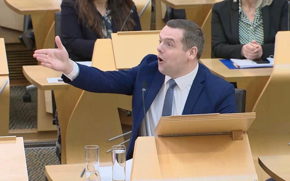 Douglas Ross, the leader of the Scottish Conservatives, gestures today during FMQs