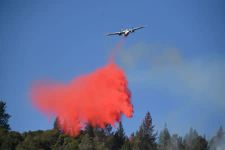 A tanker drops retardant while battling the Ponderosa Fire east of Oroville, California, U.S. August 30, 2017. REUTERS/Noah Berger