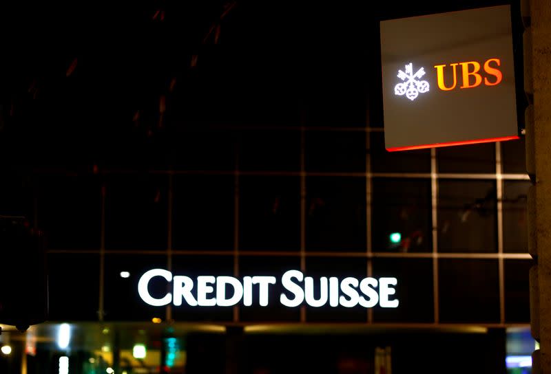 Logos of Swiss banks UBS and Credit Suisse are seen in Basel