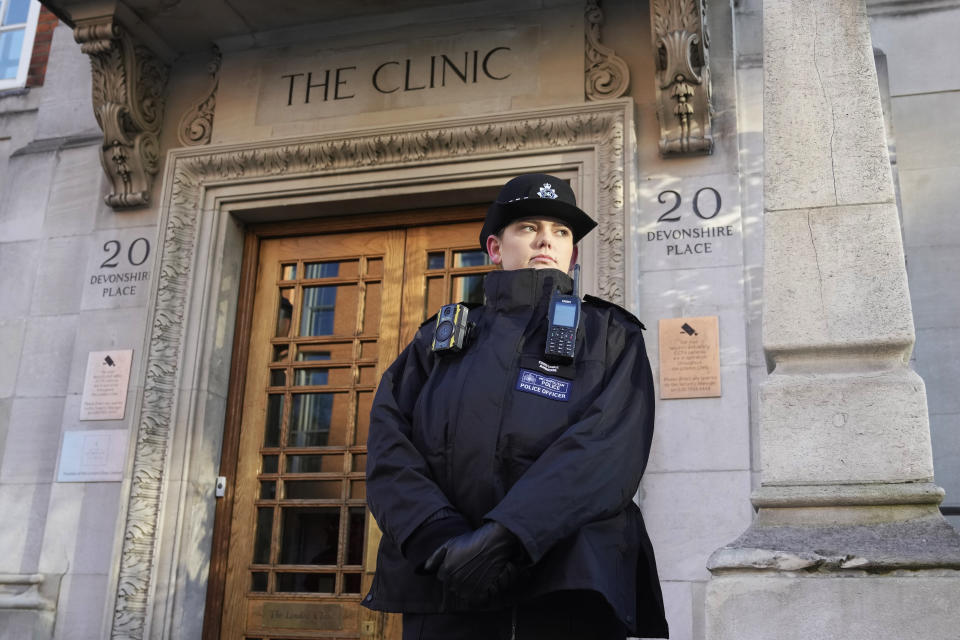 A Policewoman stands guard outside The London Clinic where Kate Princess of Wales is recovering from surgery, in London, Thursday, Jan. 18, 2024. Kensington Palace says the Princess of Wales has been hospitalized after undergoing planned abdominal surgery and will remain at The London Clinic for up to two weeks. (AP Photo/Kin Cheung)