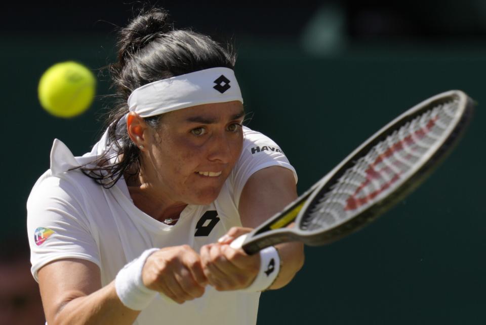 Ons Jabeur returns a shot during the Wimbledon women's championship match on Sunday.