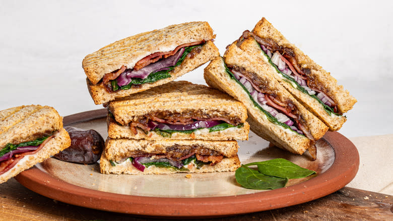 Goat cheese, bacon, and date panini sliced in half