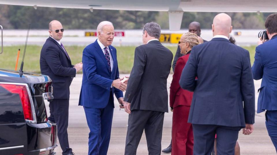 President Joe Biden is greeted by Gov. Roy Cooper after arriving via Air Force One at RDU International Airport Tuesday, March 28, 2023.