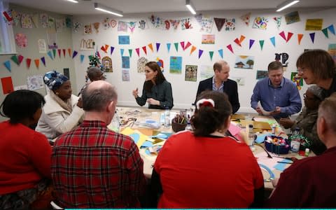 Kate and William speak to clients and staff at The Passage - Credit: Getty