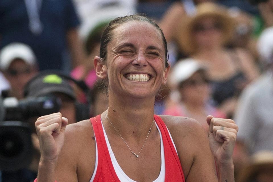 Roberta Vinci of Italy celebrates after defeating Kristina Mladenovic of France in their quarterfinals match at the U.S. Open Championships tennis tournament in New York, September 8, 2015. REUTERS/Adrees Latif