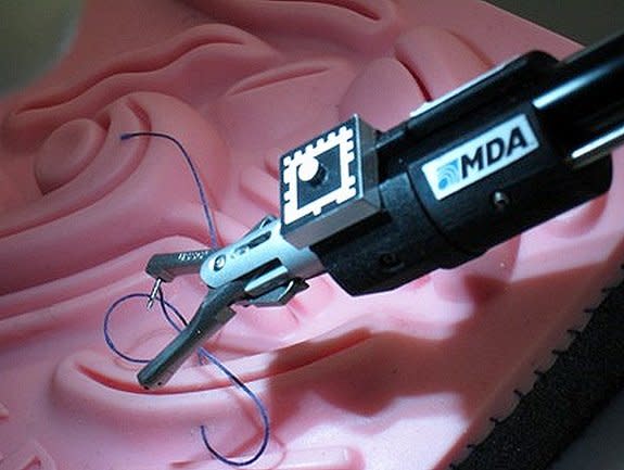 Close-up of the suturing tool on KidsArm doing simulated image-guided anastomosis (connecting parts such as vessels).