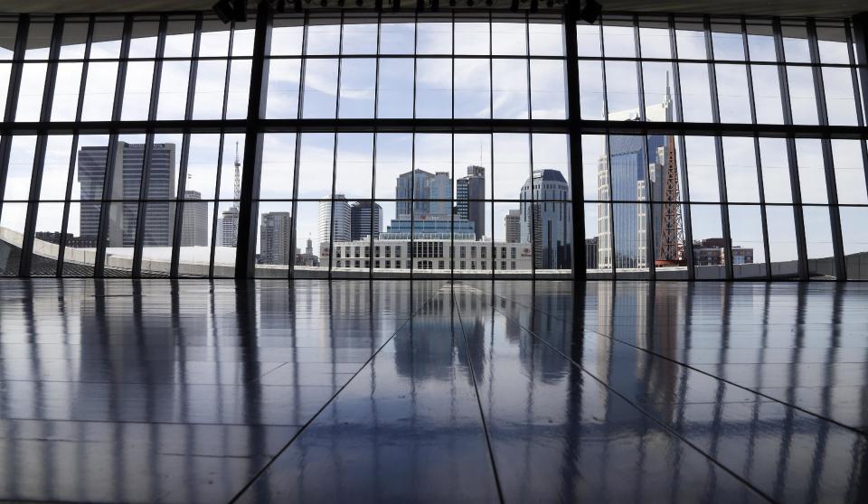 In this April 10, 2014, photo, a new event hall overlooks the Nashville skyline at the Country Music Hall of Fame and Museum in Nashville, Tenn. A $100 million expansion provides more interactive and contemporary exhibits as well as providing new meeting and performing space. (AP Photo/Mark Humphrey)