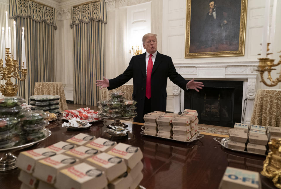 WASHINGTON, DC - JANUARY 14: (AFP OUT) U.S President Donald Trump presents fast food to be served to the Clemson Tigers football team to celebrate their Championship at the White House on January 14, 2019 in Washington, DC. (Photo by Chris Kleponis-Pool/Getty Images)