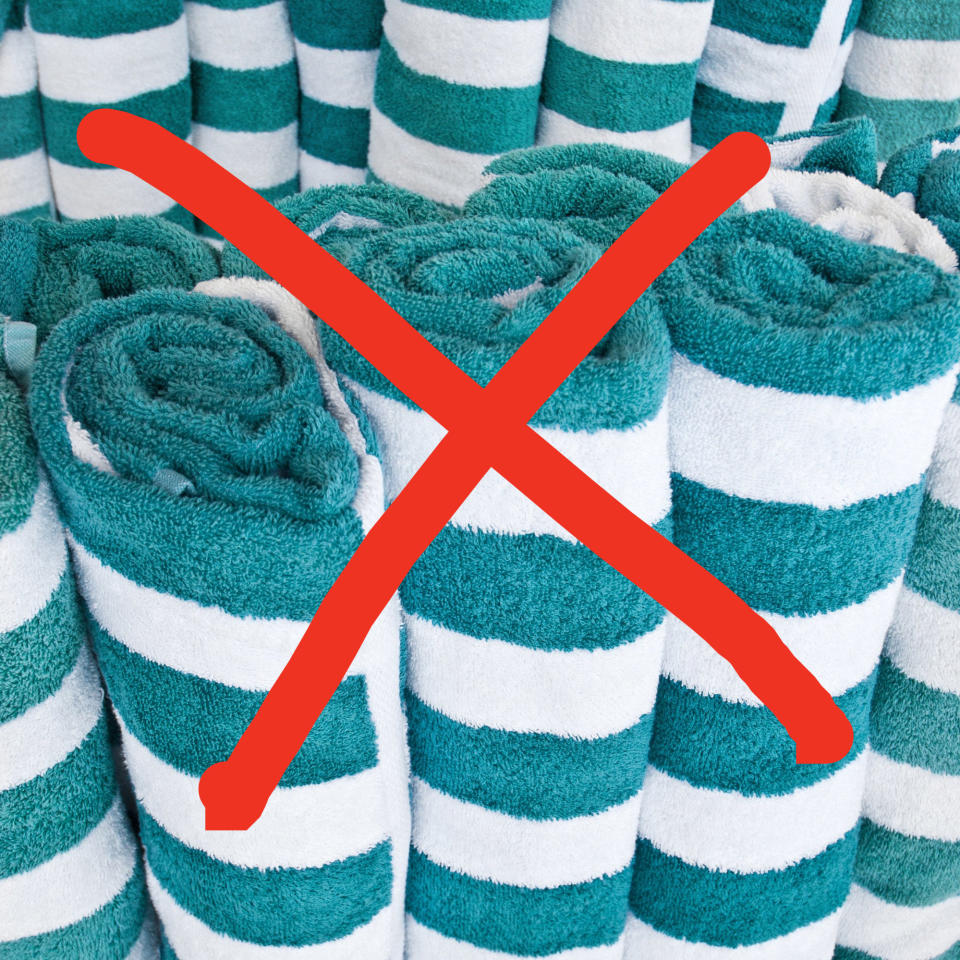 Rolls of beach towels with an 'X' drawn over them