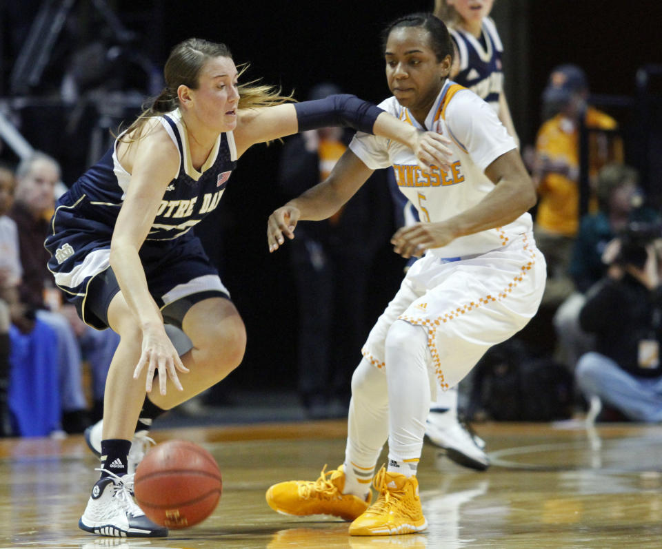 Notre Dame guard Madison Cable (22) works against Tennessee guard Ariel Massengale (5) in the first half of an NCAA college basketball game Monday, Jan. 20, 2014, in Knoxville, Tenn. (AP Photo/Wade Payne)