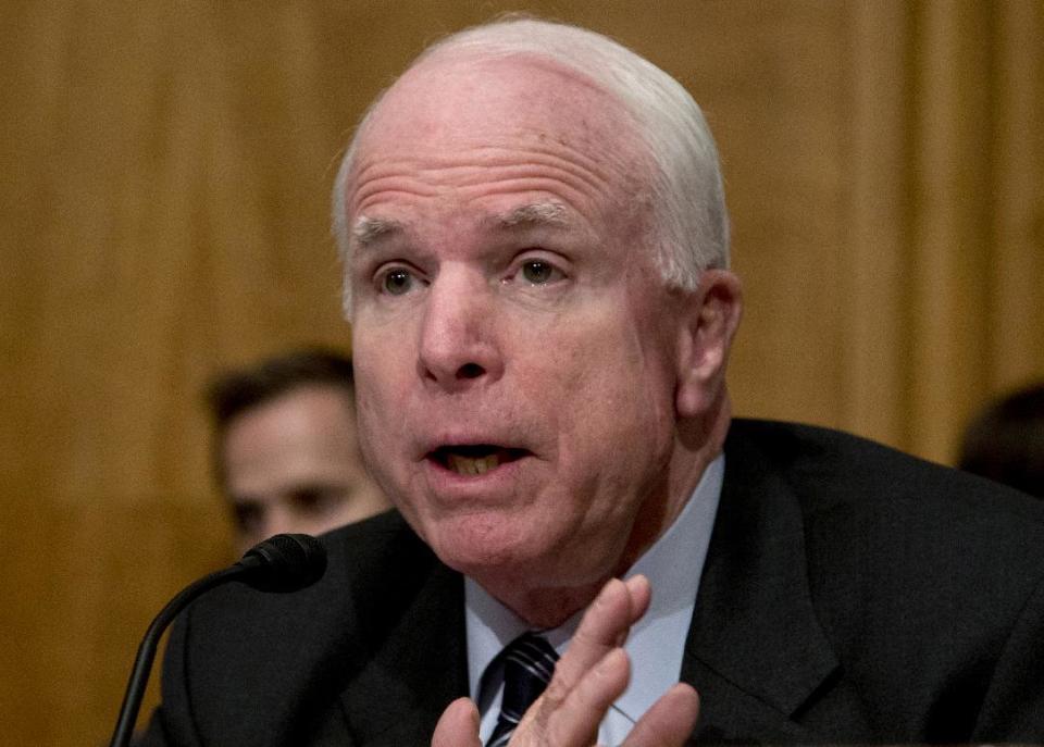 FILE - In this Nov. 13, 2013 file photo, Sen. John McCain, R-Ariz. speaks on Capitol Hill in Washington. McCain and Tim Kaine, D-Va., unveiled legislation on Thursday that would repeal the 1973 War Powers Resolution, often ignored by presidents of both parties, and replace it with a new law that requires greater consultation and a congressional vote within 30 days on any significant armed conflict. (AP Photo/Carolyn Kaster, File)