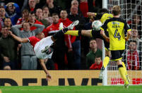 Soccer Football - Carabao Cup Third Round - Manchester United vs Burton Albion - Old Trafford, Manchester, Britain - September 20, 2017 Manchester United's Anthony Martial has his shot blocked by Burton Albion's Tom Flanagan Action Images via Reuters/Jason Cairnduff EDITORIAL USE ONLY. No use with unauthorized audio, video, data, fixture list