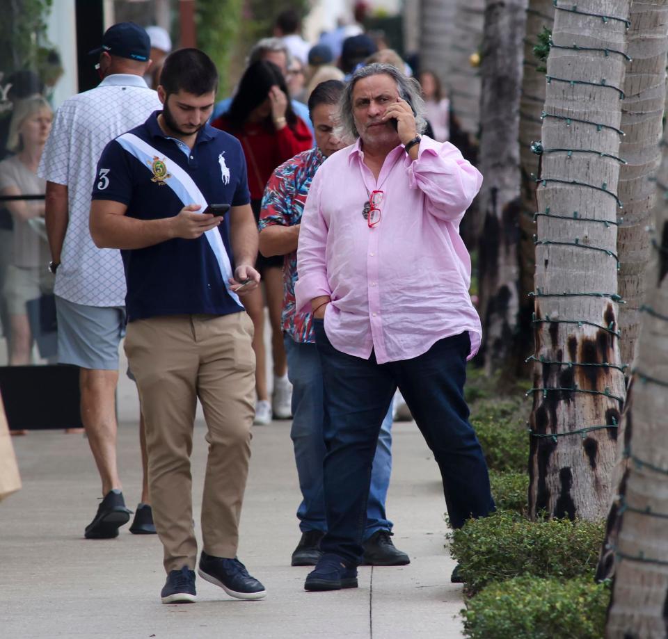 Gallery president Daniel Bouaziz listens to his phone on Tuesday on Worth Avenue.