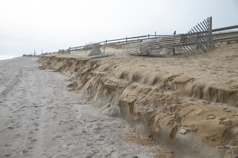 A Toms River police officer looks over the beach where severe erosion has been a problem. A portion of the beach has a 4-5â€™ drop-off where recently replenished sand has washed away.Ortley Beach, NJFriday, January 28, 2022 