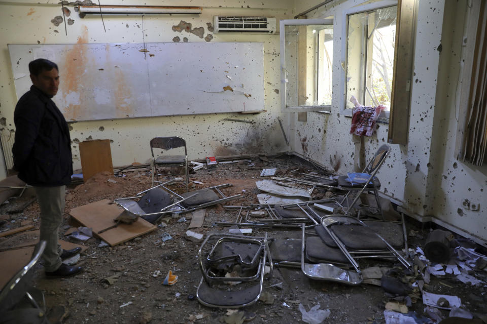 A man stands inside a damaged room at the Kabul University following a deadly attack in Kabul, Afghanistan, Tuesday, Nov. 3, 2020. The brazen attack by gunmen who stormed the university has left many dead and wounded in the Afghan capital. The assault sparked an hours-long gun battle. (AP Photo/Rahmat Gul)