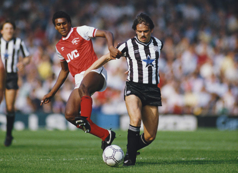 Newcastle United player Alan Davies (r) is challenged by David Rocastle of Arsenal during a Canon League Divsiion One match at Highbury on September 28, 1985 in London, England.