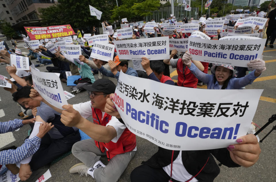 South Korean fishermen stage a rally against the planned release of treated radioactive water from the wrecked Fukushima nuclear power plant, in front of the National Assembly in Seoul, South Korea, Monday, June 12, 2023. (AP Photo/Ahn Young-joon)