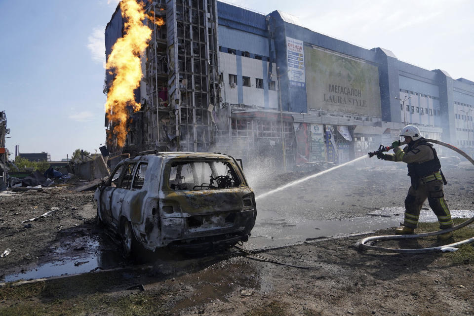 Firefighters put out a fire after a Russian missile attack in Kharkiv, Ukraine, on September 1, 2024. (Andrii Marienko / AP)