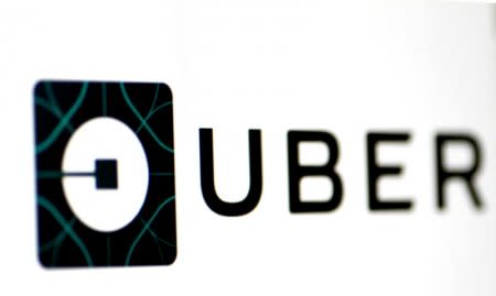 FILE PHOTO: The Uber logo is seen on a screen in Singapore August 4, 2017. REUTERS/Thomas White/File Picture