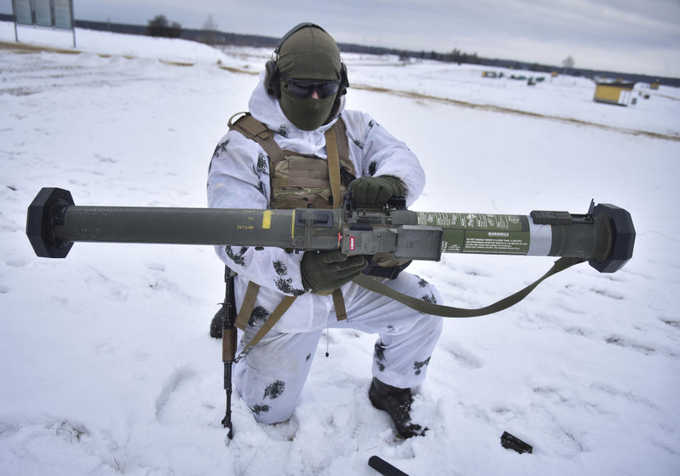 A Ukrainian soldier trains for the use of US M141 Bunker Defeat Munition (SMAW-D) missiles at the Yavoriv military training ground, close to Lviv, western Ukraine, Friday, Feb. 4, 2022. The U.S. accused the Kremlin on Thursday of an elaborate plot to fabricate an attack by Ukrainian forces that Russia could use as a pretext to take military action against its neighbor. (AP Photo/Pavlo Palamarchuk)