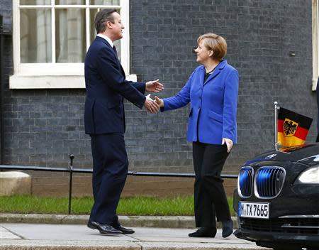 Britain's Prime Minister David Cameron greets Germany's Chancellor Angela Merkel at Number 10 Downing Street in London February 27, 2014. Merkel cautioned Britain on Thursday that she could not promise a fundamental reform of Europe that would satisfy all Britain's wishes. REUTERS/Andrew Winning