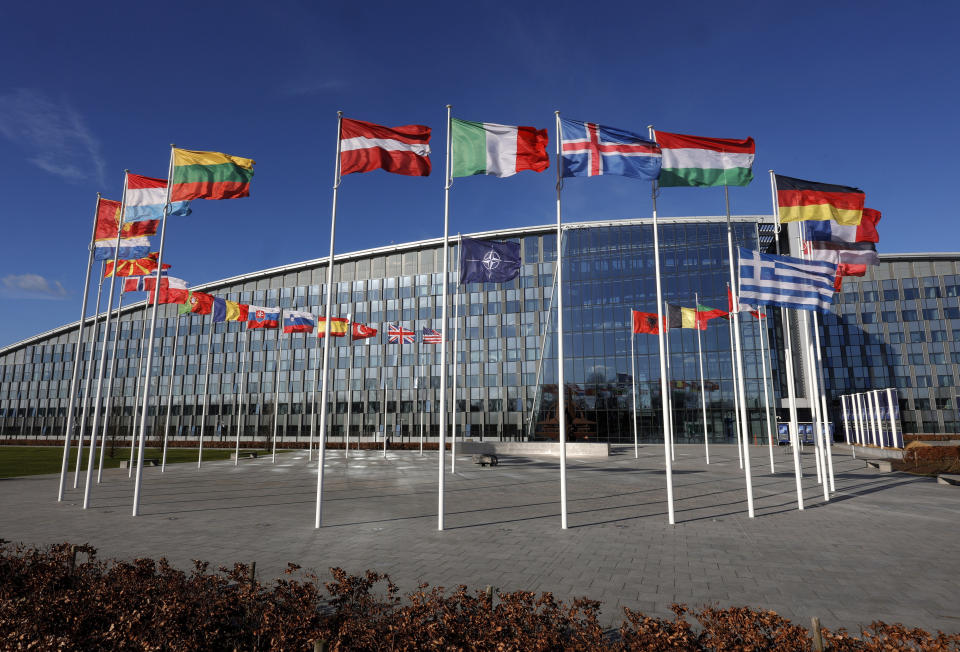 FILE - Flags flutter in the wind outside NATO headquarters in Brussels, Feb. 7, 2022. Finland and Sweden have signaled their intention to join NATO over Russia’s war in Ukraine and things will move fast once they formally apply for membership in the world’s biggest security alliance. Russian President Vladimir Putin has already made clear that there would be consequences if the two Nordic countries join. (AP Photo/Olivier Matthys, File)