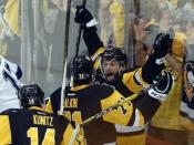 May 26, 2016; Pittsburgh, PA, USA; Pittsburgh Penguins right wing Bryan Rust (R) celebrates with left wing Chris Kunitz (14) and center Evgeni Malkin (71) after scoring a goal against the Tampa Bay Lightning during the second period in game seven of the Eastern Conference Final of the 2016 Stanley Cup Playoffs at the CONSOL Energy Center. The Penguins won the game 2-1 and the Eastern Conference Championship four games to three. Mandatory Credit: Charles LeClaire-USA TODAY Sports