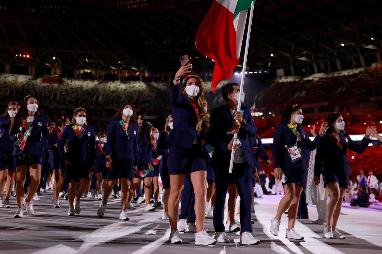 Mexico's flag bearers Gabriela Lopez (C-L) and Rommel Pacheco Marrufo  (C-R)  lead their delegation as they parade  during the opening ceremony of the Tokyo 2020 Olympic Games, at the Olympic Stadium, in Tokyo, on July 23, 2021. (Photo by Odd ANDERSEN / AFP) (Photo by ODD ANDERSEN/AFP via Getty Images)