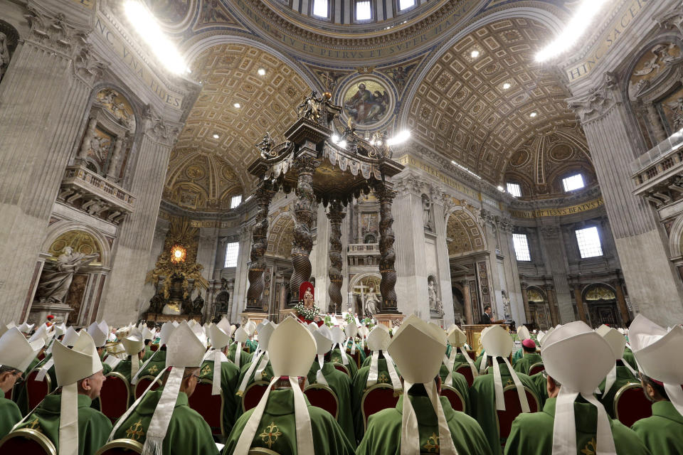 FILE - A view St. Peter's Basilica as Pope Francis celebrates a Mass for the closing of the synod of bishops at the Vatican, Sunday, Oct. 28, 2018. Pope Francis is convening a global gathering of bishops and laypeople to discuss the future of the Catholic Church, including some hot-button issues that have previously been considered off the table for discussion. Key agenda items include women's role in the church, welcoming LGBTQ+ Catholics and how bishops exercise authority. For the first time, women and laypeople can vote on specific proposals alongside bishops. (AP Photo/Andrew Medichini, File)