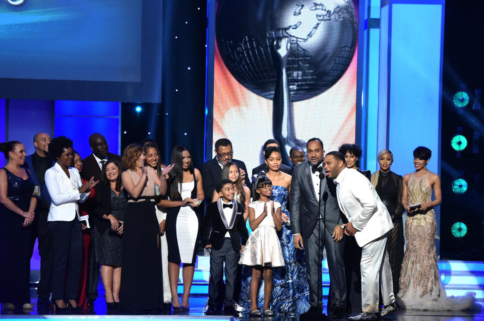 The cast and crew of 'Black-ish' accept the Outstanding Comedy Series award onstage.