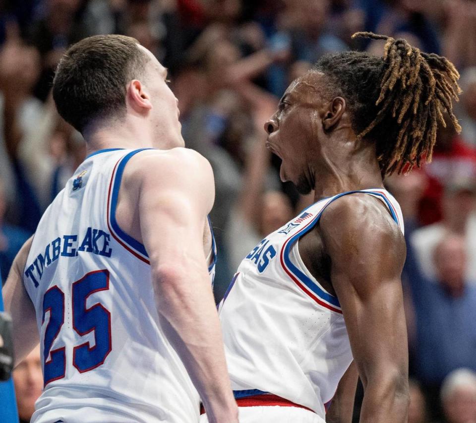 Kansas Jayhawks guard Jamari McDowell (11) celebrates an alley-oop dunk by guard Nicolas Timberlake (25) during an NCAA basketball game against the Texas Longhorns on Saturday, Feb. 24, 2024, in Lawrence.