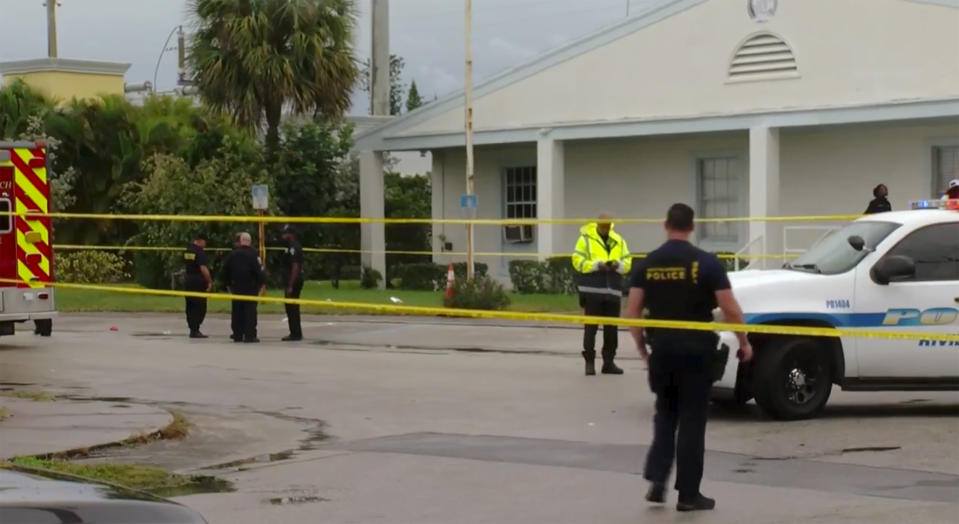 This still image taken from video provided by WPEC CBS 12 News shows emergency responders at the scene of a shooting at the Victory City Church in Riviera Beach, Fla., Saturday, Feb. 1, 2020. Fatalities were caused by gunfire that erupted at a funeral according to authorities. (WPEC CBS 12 News via AP)